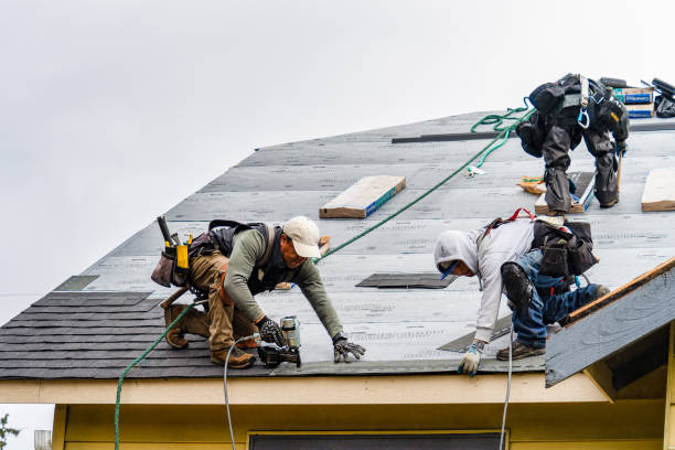 Professional Roofing technician working in East Northport, NY